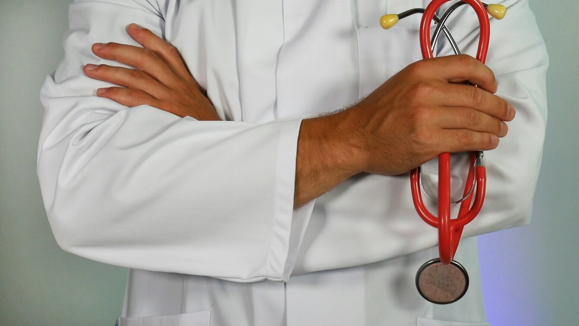 Doctor reviewing medical data on a tablet